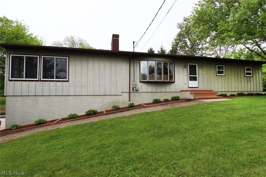 Looking for a well-maintained ranch with an open floor plan on a sprawling lot? Your search ends today! This updated ranch sits on 1.81 beautifully-landscaped acres. The inviting living room features a bay window, newer wood laminate flooring, and a  brick fireplace. The recently-updated kitchen is a chef's dream, featuring an abundance of counter space, a beautiful island, newer cabinets, soft-close drawers, a gorgeous backsplash, a spacious dinette....the list of features goes on and on. The master bedroom features dual closets and a private master bath. There are two additional bedrooms on the first floor, as well as an additional full bath. Completing the first floor is an enormous sunroom, which can be heated with space heater on cooler nights. The walk-out basement features an office/possible fourth bedroom, a recreation room, lots of storage, and a large laundry area complete with folding station. The multi-level deck and large lot are perfect for entertaining. The front, rear,