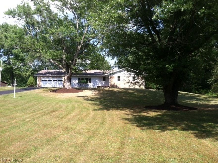 Beautiful brick ranch situated on top of the hill overlooking scenic 4 acre lot.  Privacy and quiet country living are sure to please any family in this spacious 3-4 bedroom home with 2 1/2 baths, which overflows into an amazing finished basement to please all large gatherings!  Wet bar, fireplace and lots of room to entertain!  Minutes from I-76, yet able to enjoy the abundant wildlife!