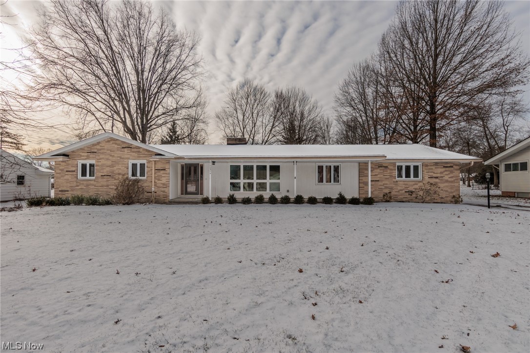 Welcome to 10314 Tanager Trail, a sprawling Brecksville Ranch situated on a .55 acre park-like property! Attractive curb appeal & covered front porch. Large and bright living room and conjoined dining area; the ideal space for formal gatherings with friends and family. The eat-in kitchen provides ample cabinetry, plenty of prep space, dining area & included appliances. Attached to the kitchen is the family room w/ charming corner fireplace, built-in shelving and slider out the the spacious sunroom overlooking the beautiful backyard. The primary suite has it's own private bathroom! Two additional bedrooms share the hall bath. Convenient main floor laundry room w/ washer, dryer & utility tub; plus a 1/2 bath completes the main level. Downstairs has a huge recreation room with a fireplace & a separate room ideal for your storage needs! More storage space is found in the extra large two car attached garage with attic pull down. Roof(2023), Driveway(2020), Sump Pump(2023) and newer Furnace & A/C. 1 year America's Preferred Home Warranty provided. This great home has so much to offer. Bring your personal style and make this home your very own!