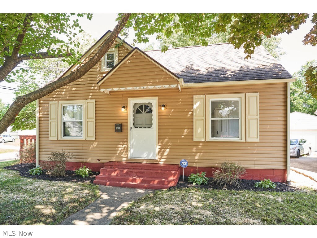 This is the home you've been searching for! Recently updated and refreshed, this home is completely move-in ready!
You will adore the gorgeous, bright and open kitchen and dining area with wood-burning stove. It has been renovated with white cabinets, new countertops and sink, stunning faux white brick walls, and LVT flooring. Two bedrooms on main floor have brand new carpet. Large third bedroom on second floor with hardwood floors could alternatively be used as an office, work out room or play room. Large first floor bathroom has been remodeled with new custom vanity. Entire first floor has been freshly painted in neutral colors. Laundry is located in the basement, where there is plenty of space for storage or a workroom.
The house is situated on a corner lot close to Goodyear Heights Metro Park. The yard has been recently landscaped with new grass planted. Private backyard is fenced in with a fire pit and is the perfect space for kids or dogs to play or for backyard parties. Attac