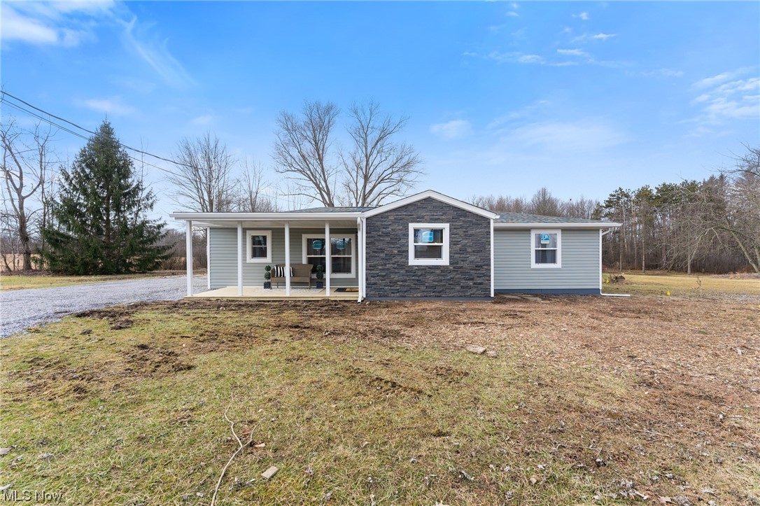 8 acres in Hubbard township with a fully remodeled house, barn with 7 stalls (can be converted into a nice garage) and a 2-car detached garage! This house has gone through a completed overhaul and now it's your opportunity to own it. As you pull into the oversized driveway, you are welcomed with all new vinyl siding, stone veneer, front porch with all new roofs from dimensional shingles on the house and garage and a new metal roof on the barn. The front porch welcomes you into a nice mud room with tile flooring and all new drywall throughout. The living room opens into a large eat in kitchen and dining area with a new flooring, light fixtures and freshly painted throughout. The kitchen has tons of cabinet space, granite counter tops, subway backsplash, all new appliances, and a perfect island with seating to accent the space perfectly! The laundry room is nested off the side of the living room with an elegant wallpaper accented wall and a new 100-amp panel. The full bathroom offers plenty of space with a new vanity, tub, subway tiled walls, fixtures and tile flooring. The 2 bedrooms are large with all new carpet and nice sized closets in each. There is another extra room that hosts the new HVAC, new hot water tank, new pressure tank and new water softener. Everything has been updated from the walls, plumbing, electrical, etc. A large horse barn has a new metal roof, freshly painted wood siding, 7 stalls, tack room (needs work) and lien to ideal for someone who has horses or wants a large outbuilding for storage or another garage. 2-car detached garage. Shed/Chicken coop. Large pasture out back with a wooded area towards the backside of the property. This house is located near Harding Park and close distance to town. Hubbard School District. This house is a once in a lifetime opportunity to have everything you've ever wanted so schedule today before it's too late!