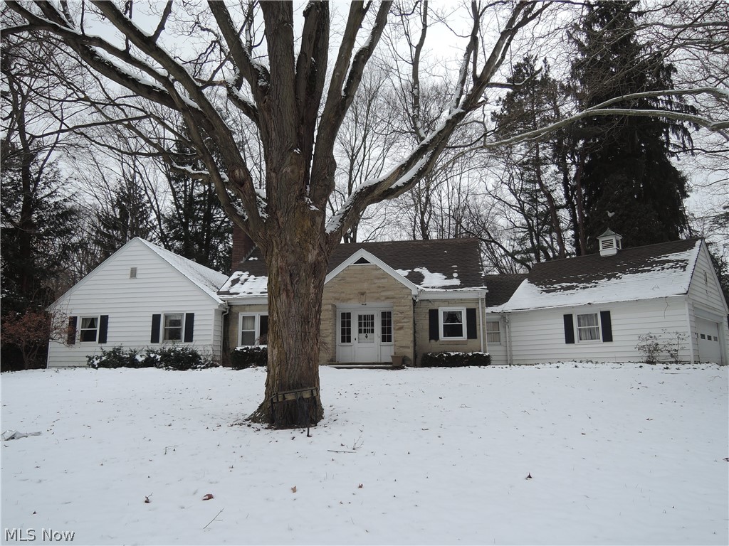 Charming home on a beautiful 2.17 acre lot with a ravine view. Fully equipped kitchen, huge dining room and heated all season sun room overlooking the patio. First floor master suite with updated bath and double closets and 2nd bedroom. Second floor has 2 additional bedrooms and full bath. Full basement rec. room with fireplace. This quality built home has crown molding and hardwood along with many new vinyl windows. The exterior has a circular drive and is bordered with a split rail fence. Must see home - you'll love this property. Home Warranty offered.