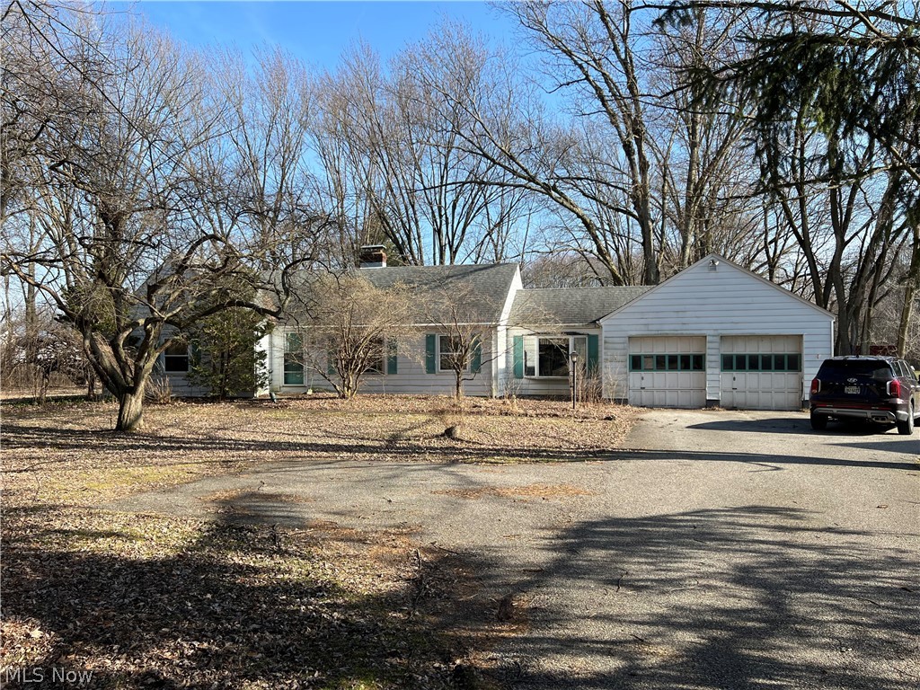 AMAZING INVESTMENT OPPORTUNY!!! Ranch style home with 3 bedrooms and a 2 car attached garage. Beautiful 3 acre parcel of land in the heart of North Ridgeville with a pond and wooded area in the back of the lot. Would be perfect for a full rehab or brand new build! Great location very close to UH Hospital, minutes from 480 and the turnpike. Tons of shopping and restaurants as well as a park nearby!