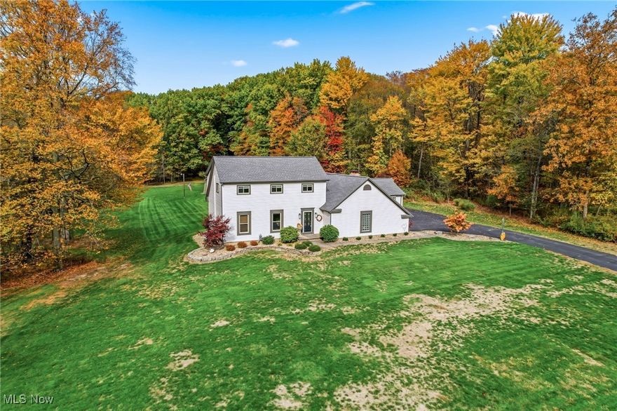 Welcome to this beautifully preserved four-bedroom colonial nestled on over 2.6 acres within the highly sought-after Canfield School District. This unique property offers a multitude of possibilities, including a potential private in-law suite with ample space for a second kitchen, making it an ideal choice for multi-generational living. It also boasts a stunningly updated open kitchen.
Step inside and be greeted by a thoughtfully updated home featuring:- Roof and siding replaced in 2020 - Ohio State Waterproofing was installed in 2016 with a lifetime transferable guarantee, and a new sump battery was installed in 2025- A septic aerator installed in 2025 - A kitchen remodel completed in 2017 and a master bath remodel completed in 2011 - A half-bath remodel completed in 2013 - All doors and windows replaced in 2010 - A garage door replaced in 2020 Outdoors, the property features charming two-out buildings with electric power, a larger shed equipped with a portable heat source, perfect for hobbies, animals, or extra storage. The gorgeous backyard offers a beautiful view and is truly special—private, peaceful, and ready for entertaining, gardening, or simply relaxing.  This home comes with a one-year home warranty. This rare find combines ample acreage, thoughtful updates, and an ideal location in Canfield. It’s conveniently close to the Canfield Fairgrounds and the Millcreek Bike Trail, making it a fantastic lifestyle opportunity.