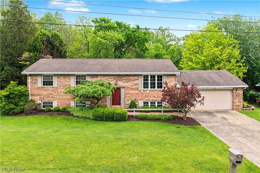 First time offered on the market! This well-loved home offering 4-bedroom, 2.5-bath is on approximately .76+/- acres and offers a peaceful setting with a backyard overlooking the woods for added privacy and enjoyment. The main level features a spacious living room open to the dining area, which leads to a screened-in back porch — the perfect place to relax and enjoy the natural surroundings. The dining area also flows into a large eat-in kitchen complete with stainless steel appliances and plenty of cabinet space. The main level additionally offers two guest bedrooms, a spacious full bath, and a generously sized master suite with double closets and a private master bath. The lower level provides even more living space with a large fourth bedroom that would also make an ideal home office, a beautifully updated oversized family room featuring a wood-burning fireplace, a half bath, and sliding doors leading to the back patio and backyard. This property has been lovingly maintained through the years and reflects pride of ownership throughout. While some cosmetic updates may allow a new owner to add their own personal touches, the home offers solid space, warmth, and endless potential in a desirable setting.