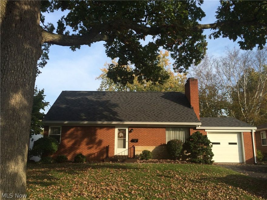 This three bedroom, brick bungalow, has been lovingly maintained over the years, is conveniently located, and sits on a lovely tree lined street. The spacious living room has one of two fireplaces that can be found in the home. An attractive country kitchen has newer laminate flooring and is open to the dining room.  The first floor master bedroom has a nice sitting room attached to it. Or, you have the option of making this a large first floor family room, and using one of the spacious upstairs bedrooms for the master.  A half bath upstairs is a plus!  The full basement has the second fireplace, and could easily be finished for a great family room. You will love sitting in the enclosed three season room, easily accessed from the dining room, and overlooking your park like back yard. The yard is fully fenced in, with brick patio area and storage shed. Attractive price for an attractive home!