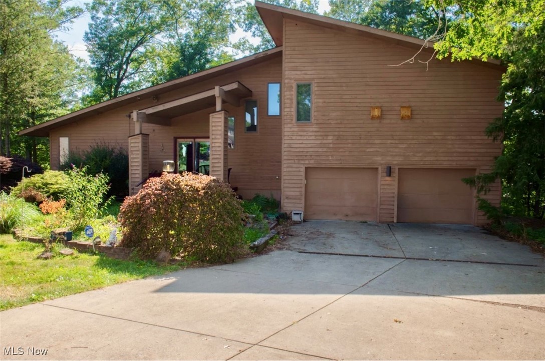 Welcome to 31 Cherokee Drive tucked in a quiet cul-de-sac in a desirable Girard neighborhood! This spacious and well-maintained home offers versatile living areas, plenty of natural light and a fantastic backyard retreat! The front entrance offers a loft foyer that overlooks the great room. To the left there are two generously sized bedrooms and a full bathroom with a skylight providing natural light while still offering privacy. To the right there is an oversized master suite complete with a full bathroom, large walk-in closet and a private balcony. Descending to the lower level you will enter the great room with high ceilings and oversized windows that offer a spectacular view of the wooded back yard. The dining area is currently being used as a home gym and has also been used as a theater room. The kitchen comes well equipped with stainless steel appliances including a 5-burner cooktop, double oven and breakfast bar. The lower level also offers a laundry/utility room, a half bath and bonus room with deck access that can be used as a bedroom or office. The back deck is a great place to relax, unwind and enjoy an evening in the hot tub under the stars. The wooded back yard offers both beauty and privacy. The spacious attached garage has parking for two and room for storage or a workspace. This lovely home is just minutes from parks, shopping, schools as well as the highway- a perfect balance of convenience and charm! Schedule your showing today!