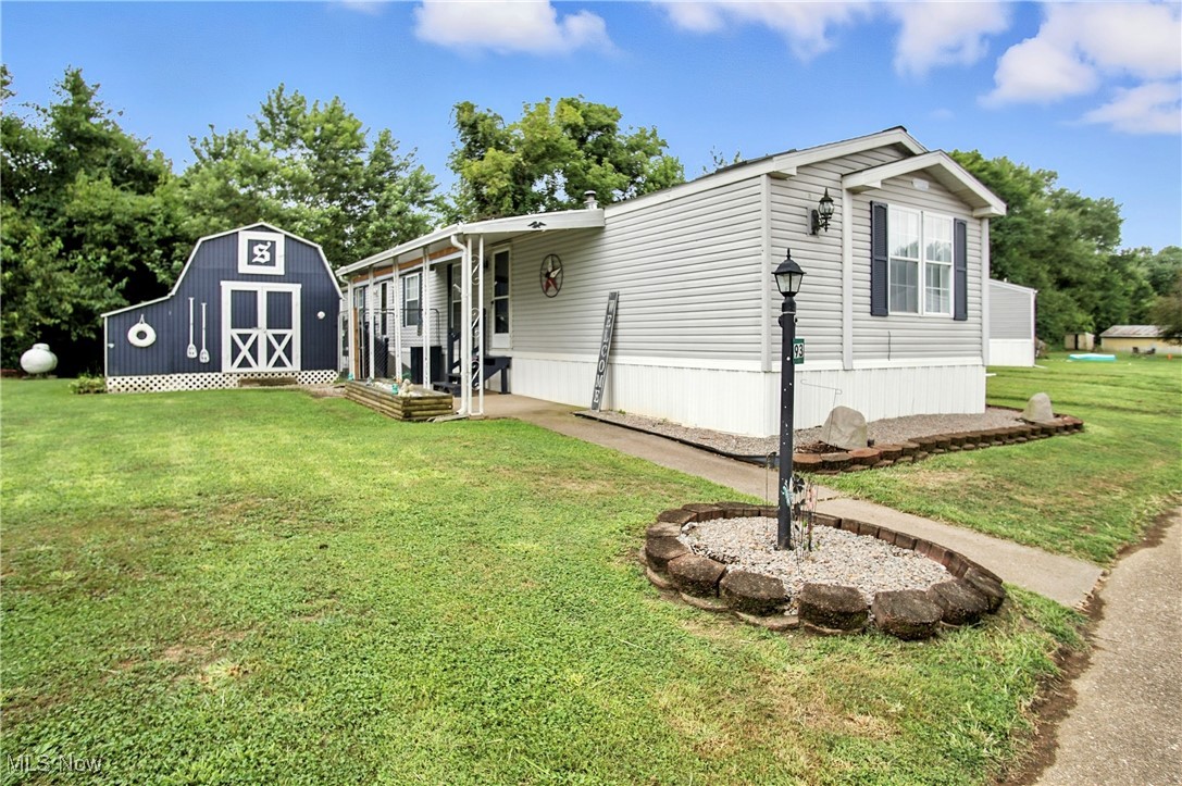 Move-in ready 3 bedroom, 2 full bath home located in Chateau Estates, Franklin Local Schools—just minutes from downtown Zanesville! This beautifully maintained home features solid oak kitchen cabinets with plenty of storage, a spacious master suite with garden tub & stand-up shower, and recent updates including new HVAC & hot water tank (2023). Enjoy the flat lot with an oversized insulated storage building, complete with electric, exhaust fan, attic, and a secure lean-to for extra storage. A handicap-accessible ramp leads to the back entrance. Lot rent is $335/month plus utilities. Recently remodeled, well cared for, and ready for its new owner!