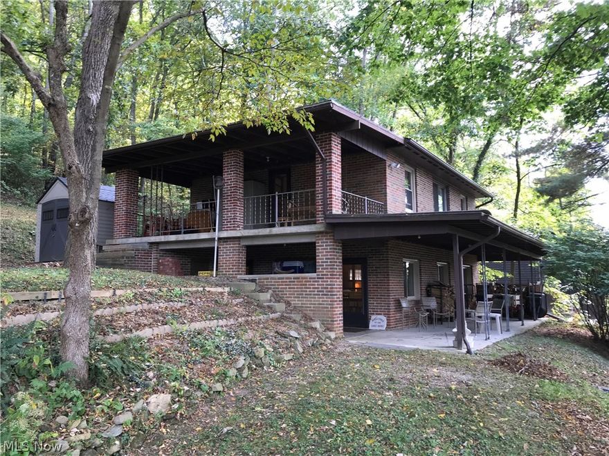 Tastefully remodeled brick home at Tappan Lake!  Perfect home for year round living or a weekend get a way.  Unique stone fireplace in the living room.  Updated oak kitchen with breakfast bar includes stainless steel appliances.  First floor laundry room.  Ceramic tile floors and ceramic tile shower in the first floor guest bath.  Spacious master bedroom with private access to the 2nd floor covered porch.  Geothermal heating system.  200 amp electric.  Vinyl replacement windows throughout.  Seasonal lake views!  7 X 6 vinyl storage shed.  20' dock on the water.  MWCD lease fee of $1,654 for 2017.  LotT-122.  This is a must see!