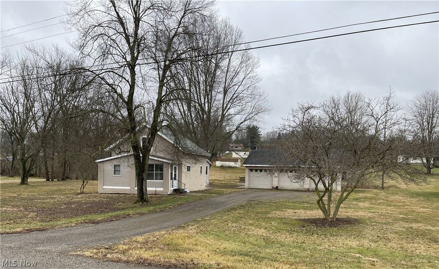 Well maintained Canton South home with just under 1.5 acres.  This home has so much to offer with large eat in kitchen with Schrock cabinetry, spacious living room, laundry, bonus room and closed in porch on the first floor.  Upstairs you will find two sizeable bedrooms with walk in closets.  Most recent updates include public water, new water supply lines, tankless hot water heater and driveway.  The large 32 x 36 garage with 220 electric and 8 foot garage doors is a huge bonus.  The beautiful lot contains fruit trees and berries and continues to the other side of the creek which can be accessed across the bridge.  Plenty of room to garden and play here.  Call your favorite agent today to see this awesome home!