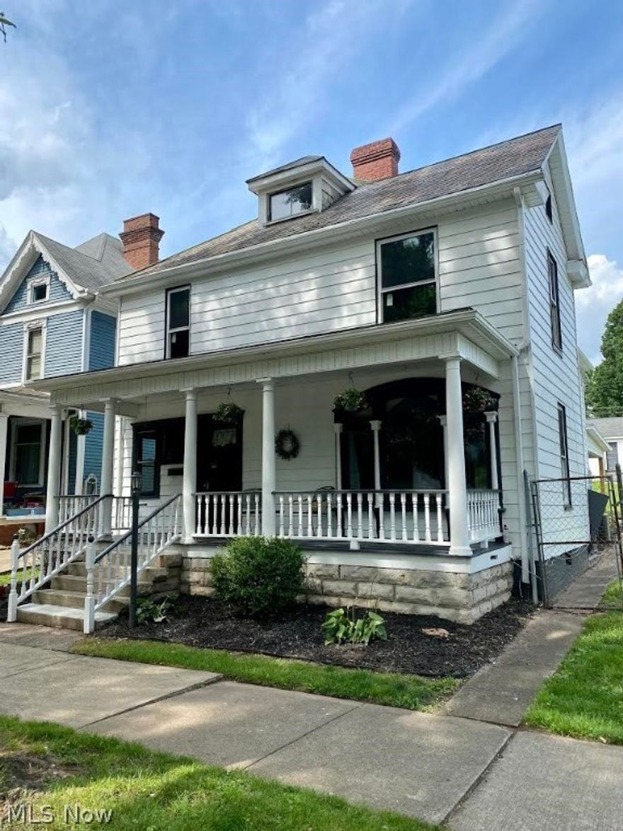 Wow! Remodeled and ready for new owners.  This four bedroom, three bath home has over 2,500 sq.ft. of living space and has been transformed into an open floor plan. The new kitchen has solid surface countertops, soft close custom cabinets, large pantry, new stainless steel dishwasher, range vent and gas stove with pot filler and luxury vinyl plank flooring.  The master suite has an added master bath (large tiled shower with rain and jetted shower system, double sinks) and 13 X 9 walk in closet. Both full baths have been updated with vanity, toilet, bathtub and faucets. Two new central air units, freshly painted interior, added lighting and ceiling fans. Other amenities include gorgeous original woodwork, hardwood flooring, front and back staircases, first floor laundry, inviting front porch, open back porch, fenced in yard and a large detached garage with one garage door and the potential to add two more garage doors. 200 amp service, new plumbing throughout, attic storage. Convenientl