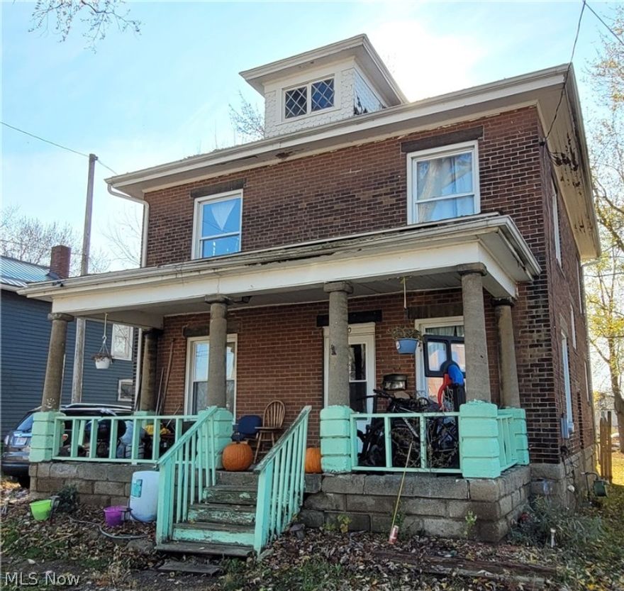 Two separate rental properties on one city lot. Large 3 bedroom brick house in front is in decent shape, tenants pay all utilities. Smaller 1 bedroom wood house to the rear needs work, owner pays all utilities. Both houses currently occupied.