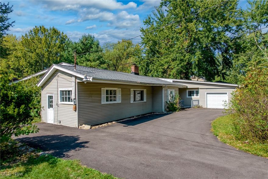 Discover this newly remodeled 5-bedroom ranch on nearly two acres in North Ridgeville, a thoughtful blend of modern updates and peaceful privacy. Five generous bedrooms include a primary suite with a dedicated sitting area and a gas fireplace, plus a newly updated full bath. The open-concept heart of the home showcases dark hardwood floors that flow off the spacious living room and the remodeled eat-in kitchen, featuring granite countertops, a practical butler back-kitchen/pantry, and tile accents in the adjoining family room. A convenient mud room and a first-floor half bath add everyday practicality, while the laundry room keeps chores organized. The versatile bonus room with garage access is perfect for a home office, media room, or hobby space. Outdoors, enjoy a large grassy yard ideal for entertaining, play, or garden projects, plus a 24x19 storage shed and a substantial 500 sq ft workshop/shed for hobbies, vehicles, or additional storage. The circular front driveway offers convenient parking and curb appeal, and the brand-new roof provides peace of mind. All in a sought-after North Ridgeville location, this home puts you minutes from parks, shops, and commuting routes, delivering a ready-to-enjoy lifestyle with room to grow.