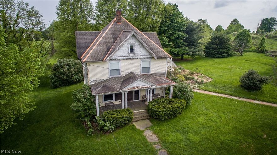 TUSLAW MINI FARM!  This horse-friendly property features a Century farmhouse and 15.5 fenced acres with 32 x 76 barn, milk house and 20' pond stocked with Blue Gill and Bass!  The spacious home has retained all of its original charm with hand-carved woodwork and tall ceilings while adding modern conveniences of a 1st-floor laundry and large open kitchen.  There are multiple living areas, a dining room with ornate gas fireplace, guest bath on the main level plus 3 bedrooms and an oversized full bathroom with a make-up vanity upstairs.  The entire property is surrounded by 6 wire tinsel fencing making it perfect for horses or other livestock with multiple outbuildings for shelter, feed, and storage.  Free gas rights from the neighboring property are an added bonus!  If you're looking for a country home with easy access to several major highways, you must see this one of a kind property!