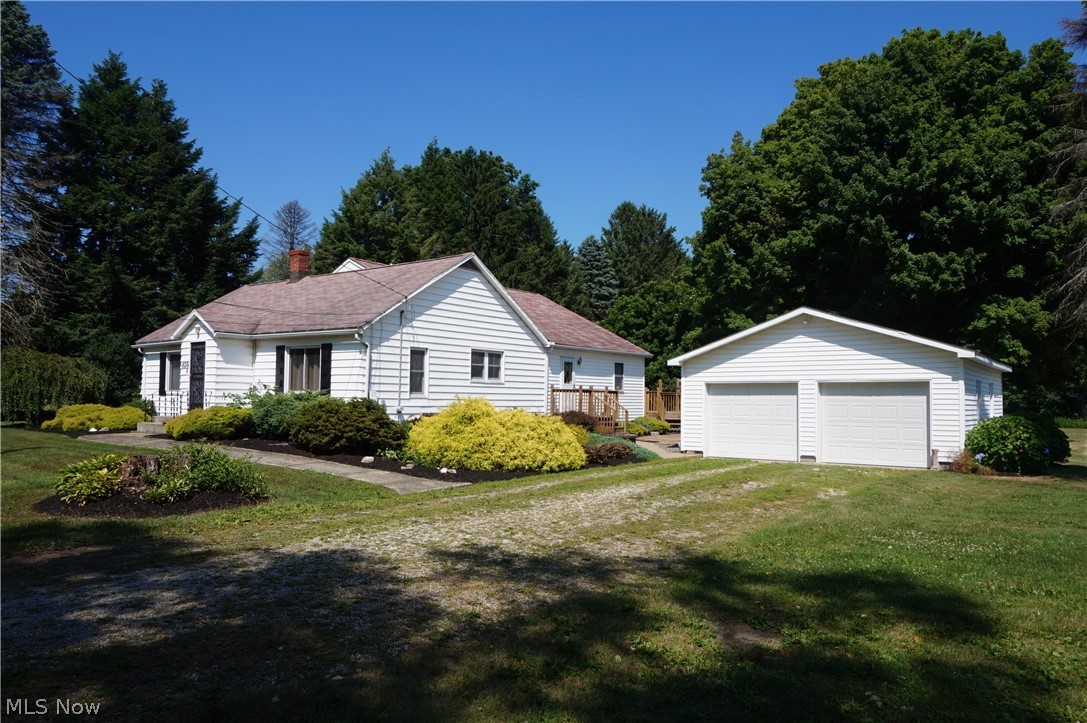 Casual Country Living Awaits! Much larger that it looks! This Spacious Raised Ranch surrounded by beautiful views of open yard, old growth trees and lovely landscaping. Large formal living/dining rooms, huge honey oak galley kitchen boasts lots of cabinets (custom pull outs/pantries), breakfast peninsula, newer range and frig, opens to family room. Master suite on main level with large walk in closet and step in shower. Additional 2 bedrooms with full bath, powder room. Entertain or relax on the double entry rear deck that overlooks serene wooded areas and glimpses of wildlife. Full basement offers a second kitchen utilized for canning, cooking for family parties or possible additional living space, laundry and finished bonus room. Oversized 2 car detached garage and single car garage/outbuilding. Building addition in 2000 included updating of electrical, plumbing, septic system. Furnace 2016, H2O tank 2020, garage roof 2021. This well maintained property is ready and waiting! Come and