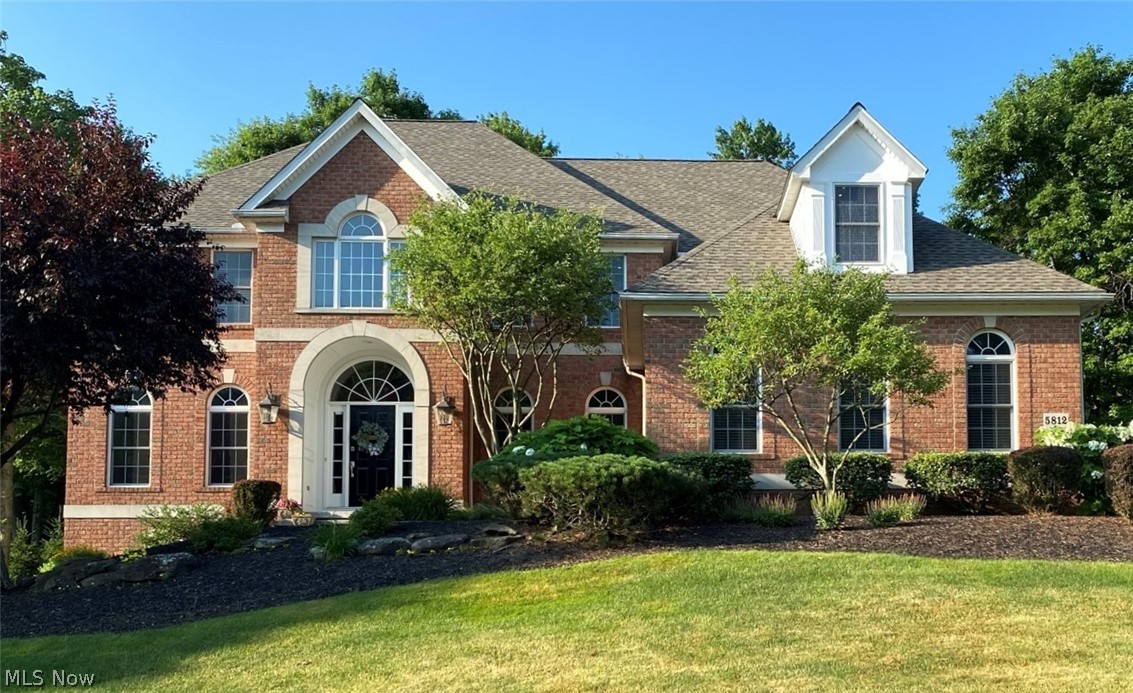 Open Floor Plan, Walk-Out Finished Basement and Walk-in closet/en-suite bath in EVERY BEDROOM!!! This custom Woodbridge colonial is located across from the Brecksville/Broadview Hts. Schools, close to Downtown Brecksville and filled with amenities and upgrades! Enter into a two-story foyer with custom wrought iron dual staircase and hardwood floors. Living and dining room feature custom lit tray ceilings and hardwood floors. "Work- from -home" in the first floor office/den with custom built-in shelves/desk, coiffured wood beamed ceiling; wired to connect to Bose surround system. Sit back in the two-story Great Room with gas fireplace and panoramic wall of windows overlooking the 3 tiered stone patio. The Main Bedroom Suite is complete with custom built-in shelves, cedar drawers, vaulted tray ceiling and gas fireplace. The Main Bathroom is spa-like featuring jetted soaking tub, dual vanities and shower with multiple jets; leading to a large walk-in closet. 3 additional bedrooms and lau