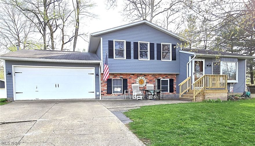 Schedule your appointment today to view this lovely, well cared for, split-level home located on a private cul-de-sac in charming Seville.  You'll enter the nice sized living room which flows into the dining area and kitchen.  The newer kitchen has cherry cabinets with Corian countertops and a sliding door to the 10 x 16 wood deck. From the deck you'll enjoy the large rear yard and park like views.  The upstairs has 3 nice sized bedrooms and bathroom.  The lower level has a large family room with newer carpet and a wood burning stove.  On this level you will also find a bathroom and an office/bedroom. There is a basement off the lower level which has all the mechanicals and laundry area.  A wonderful added bonus for this home is the newer 24 x 32 pole barn/workshop which has been insulated and drywalled with 100 AMP electric service and concrete flooring.  Conveniently located with nearby access to major highways (I-76 & I-77). This home won't last.  Call today.