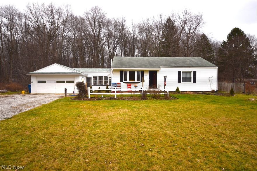 Welcome to this 1,300 square foot ranch that has a lot of possibilities for living arrangements.  It has all the conveniences of a metro suburb, with the privacy of a rural homestead on 1 acre of land surrounded by 6 acres of undeveloped land.  The backyard is private and wooded, while having potential for future investment opportunity pending the development of the surrounding land.  Inside the home, you'll find an eat-in kitchen, living room, and 3 bedrooms of which the 3rd bedroom could be used as a bonus room or office.  Updates include laminate wood floors and a whole house tankless water heater.  The home also has an enclosed breezeway and an attached 2 car garage.  This property is in a great location, as it's 5 minutes away from 480 and the turnpike.