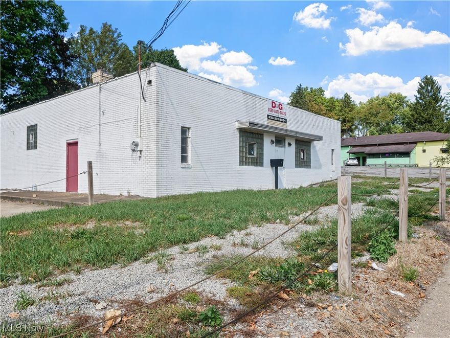 This versatile commercial property offers a rare opportunity to own over 3,000 square feet of workshop and office space in a highly visible location with excellent frontage along a busy roadway. Built with durable block construction and recently refreshed on the exterior, the building combines functionality with great exposure, making it ideal for a wide range of business uses. The expansive workshop area features high ceilings, wide open space, and automotive lifts already in place, creating the perfect setup for an auto repair shop, body shop, detailing center, or light manufacturing. The layout is highly flexible, allowing for easy customization to suit your specific needs. Large overhead doors provide convenient access for vehicles and equipment, while concrete floors are designed to handle heavy-duty use. Exposed beams and strong steel supports give the space both durability and an industrial appeal. Beyond the main workshop, the building includes two bathrooms, an electrical room, and additional office and storage areas that make daily operations smooth and efficient. Front entry areas are perfect for welcoming clients or creating a reception space, while glass block windows and natural light add to the building’s usability and comfort. Situated on a corner lot with ample parking available in the front and side of the property, it is designed to accommodate both employees and customers with ease. The excellent visibility and constant traffic flow provide strong marketing potential for signage and branding, helping any business attract new customers. This property is a perfect match for an owner-user looking to establish or expand operations in a prime commercial corridor, or for an investor seeking a property with solid potential and adaptability. With a mix of open workshop space, functional office areas, and a high-traffic location, this building offers the kind of flexibility and exposure that makes it stand out in today’s market.