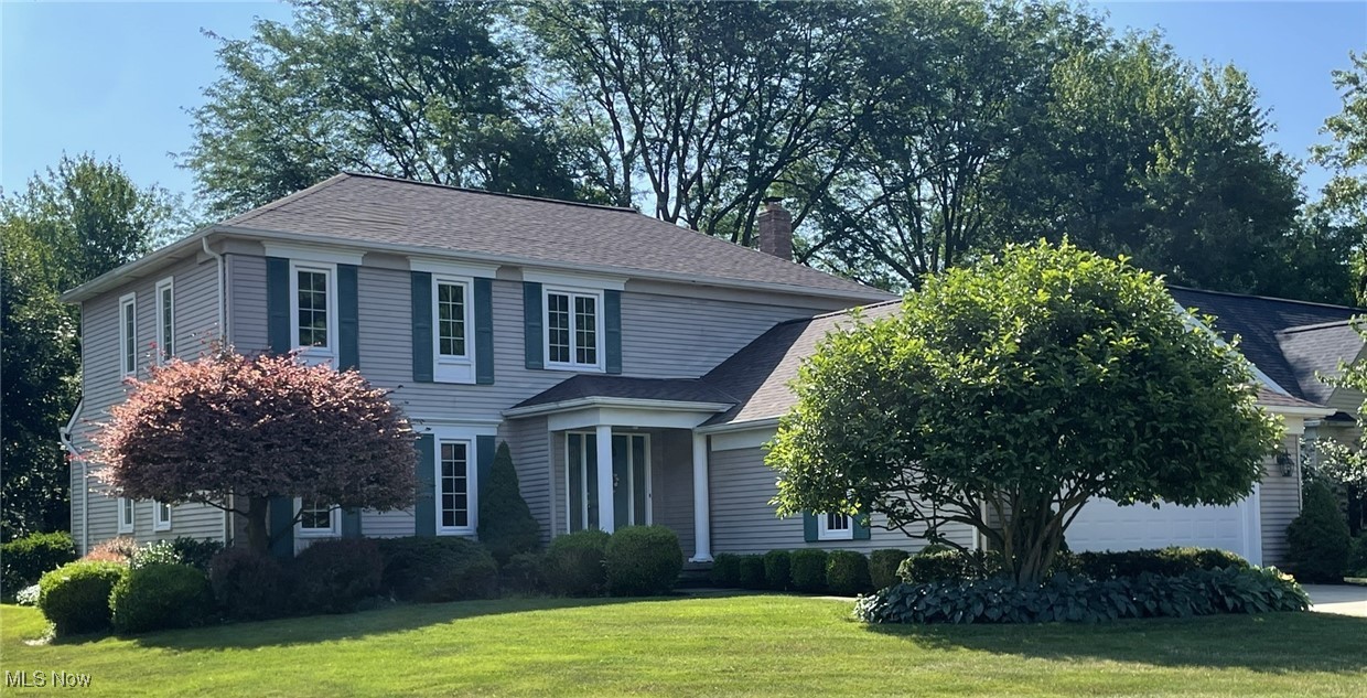 Welcome to this beautifully maintained 4-bedroom, 2.5-bathroom home nestled on a quiet cul-de-sac in Christensen Estates, one of Rocky River’s most sought-after neighborhoods. This move-in ready home offers over 3000 sq ft of comfortable living space and numerous upgrades throughout. The spacious great room, located just off the kitchen, features a custom stone gas fireplace, beamed ceilings, crown molding, and Pella sliding doors that open to a large wood deck featuring a retractable awning to enjoy shade on sunny afternoons. The eat-in kitchen includes stainless steel appliances, a large wall pantry, and sliding doors that lead to the deck, perfect for entertaining. A private home office with built-in bookcases is ideal for remote work. The first floor also includes a formal living room and dining room trimmed with crown molding, along with a convenient half bath and laundry room. Upstairs, the primary suite offers a private ensuite bath with dual-sink vanity, while the three additional bedrooms share a full bath with a jetted whirlpool tub. The partially finished basement includes a wet bar and built-in storage closet, with an additional storage closet and utility sink in the unfinished portion of the basement. The attached 2-car garage features a second utility sink with hot and cold water. Recent updates include a new furnace (Feb. 2025) and roof (Sept. 2022) for added peace of mind.