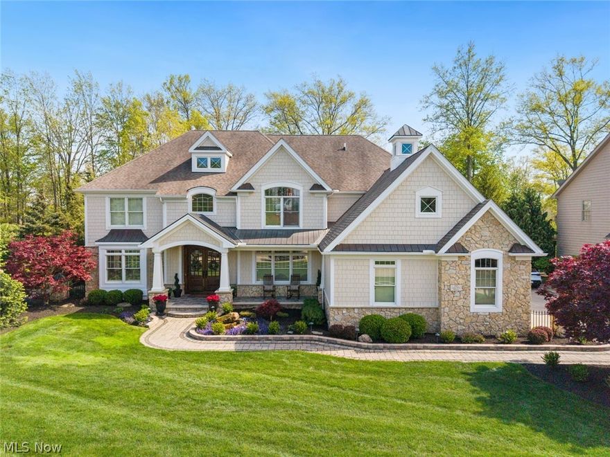This stunning custom colonial in the prestigious Legacy Pointe Community of Avon Lake, was exquisitely designed by the Arcus Group & perfectly positioned on a golf course lot overlooking the 12th fairway. Directly across from the clubhouse, pool, & tennis courts, this exceptional 4-bedroom, 5.5-bath residence offers over 6,300 sq ft of thoughtfully designed luxury living space with premium 2x6 construction, ¾-inch hardwood floors throughout, a Sonos sound system & a whole house generator. Impressive African Mahogany French doors open to a 2-story foyer featuring gorgeous marble flooring & dramatic architectural detail. The gourmet chef’s kitchen is truly spectacular, appointed with Wolf double ovens & cooktop, a full Sub-Zero refrigerator, 2 Asko dishwashers, a large island with granite counter tops. The adjoining sunroom provides a peaceful retreat with glass doors leading to an outdoor living area complete with custom hardscaping, an outdoor grill, bar area & fireplace, a serene pond & waterfall feature. The thoughtfully designed mudroom includes the laundry area, an additional pantry, & a second Sub-Zero refrigerator. Adjacent to the main living area is a private office featuring incredible custom built-ins. The main level also offers an elegant formal dining room, a sophisticated 2nd living/music room & French doors leading to the luxurious primary suite. This private retreat features a decorative fireplace, tray ceiling, spa inspired bath with dual vanities, jacuzzi tub, & 2 spacious walk-in closets. The professionally finished 1,625 sq ft lower level delivers the casual entertaining space everyone desires, complete with a full bar, custom cabinetry, & fireplace. Completing the home is a spacious 3-car attached garage with beautiful custom wood doors. Every inch of this remarkable home has been carefully designed & built with luxury, comfort & entertaining in mind. This is truly a rare opportunity to own one of Legacy Pointe’s most special homes and properties.
