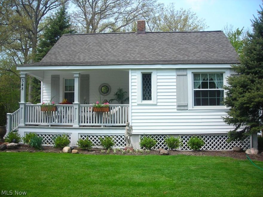 Quaint cottage style ranch situated on a large wooded lot is a rare Bay Village opportunity! Completely updated from head to toe including roof, vinyl siding, windows and doors. Welcoming front porch greets you as enter into the formal living room with built ins, wood burning fireplace, window seats and cozy office/library. Open concept kitchen and great room with laundry, utility and half bath. The great room features vaulted ceiling, hardwood flooring and a cozy fireplace. Kitchen has been renovated to offer a breakfast bar, upgraded maple cabinetry, hardwood flooring and all appliances to remain.  Updated full bath and two bedroom located off the living room. Attic is located off of a bedroom and could be turned into a loft with a spiral staircase to save space if additional living space is desired. 2-car garage, rear deck and simply a gardeners delight with loads of perennials and vegetable gardens. This is truly a home for the discerning buyer in a desirable community minutes from