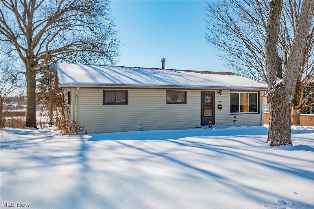 Cozy ranch located on a double city lot! This well maintained 3 bedroom ranch will be a perfect place to call home. The main floor is 1040 sqft. Fresh paint and hardwood floors throughout the living room and bedrooms. Adorable eat-in fully applianced kitchen with white cabinets and plenty of cupboard space. Nice size bathroom with large vanity. Walkout lower level is partially finished, adding 520 sqft of living space for a total of 1560 sqft. Unfinished area gives you plenty of storage / work space! Laundry located in lower level. Washer and dryer also convey with the property. Sold as-is. Make your appointment today!