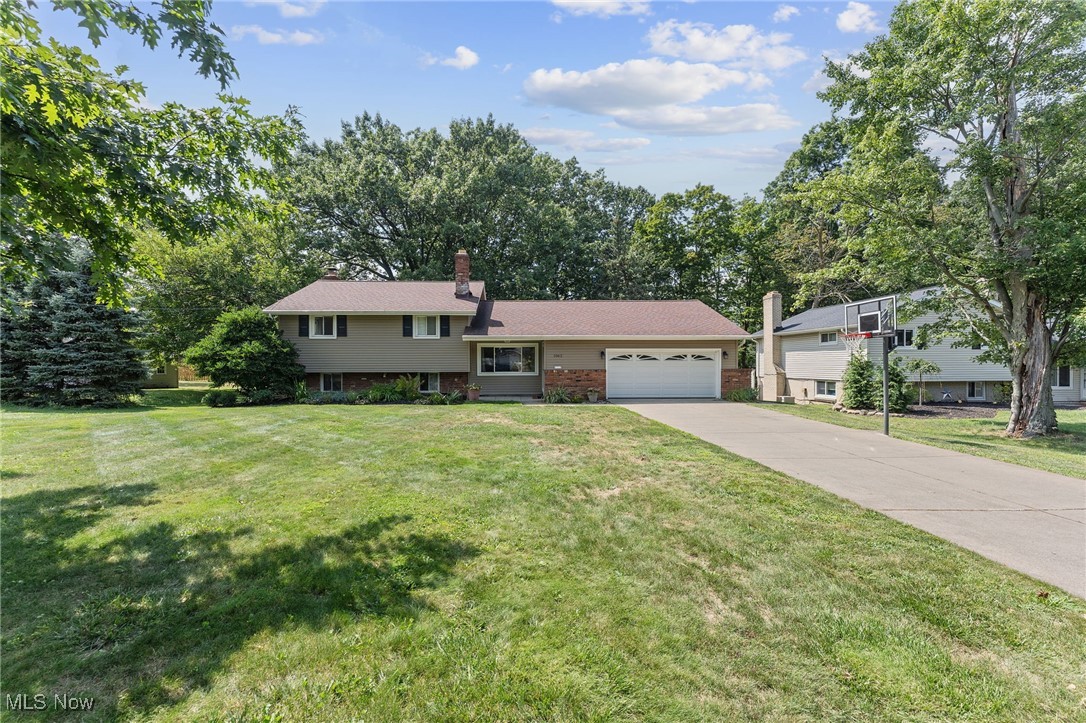 Welcome to 1062 Belwood Drive — A Timeless Highland Heights Gem with Modern Flair. Nestled on a generous 0.42-acre parcel in the heart of Highland Heights, this charming 1962-built split-level home offers the perfect blend of classic craftsmanship and contemporary comforts. With 1,948 sq ft across three thoughtfully arranged levels, discover a 4-bedroom, 2.5-bath layout. Step inside to a bright, vaulted living and dining area showcasing gleaming hardwood floors and elegant wrought-iron railing—an ideal setting for hosting and everyday gathering. Outside, entertaining expands with ease onto the double-tier deck under a canopy, overlooking a lush backyard and shed for additional storage. With an attached two-car garage, your vehicle needs and tools are neatly accommodated in one place. Positioned in the highly regarded Mayfield School District and just moments from shopping, parks, and community amenities—the location pairs suburban tranquility with convenient connectivity. Whether you're launching a growing family or seeking a forever home with charm and thoughtful updates, 1062 Belwood Drive is a standout opportunity—schedule your showing today!