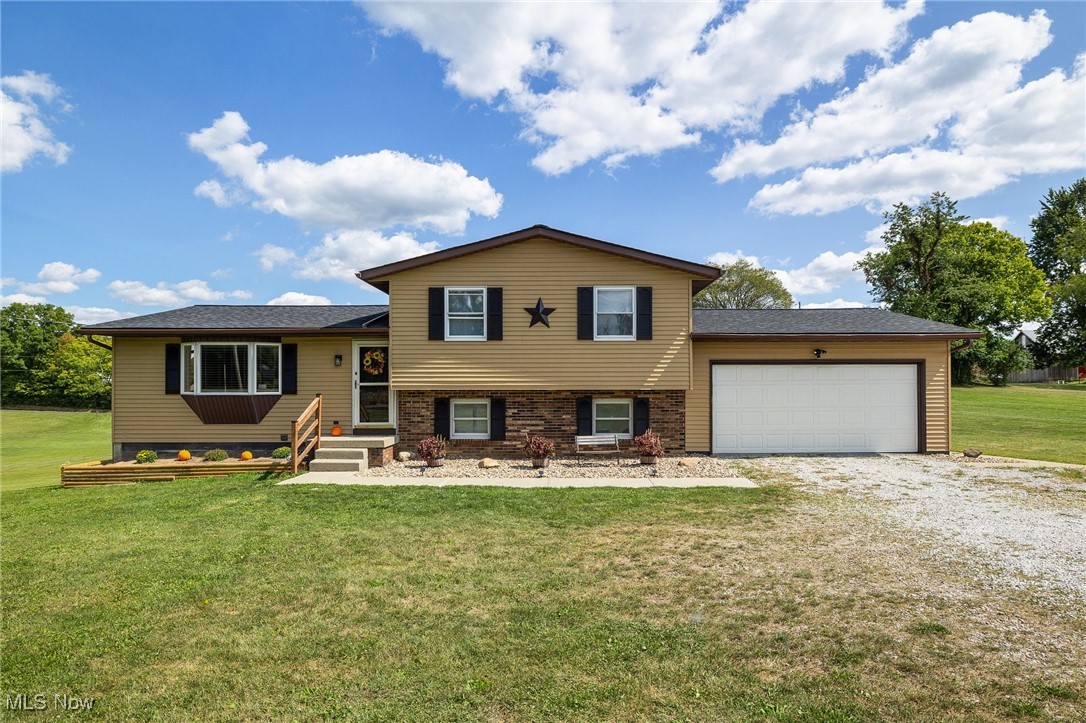 Beautifully maintained split-level home in a great location across from a nature park! Welcome to this 3 bedroom and 2 full bathroom home on a little over 2 acres. The main floor has a nice entryway leading to the living room, kitchen and dining room. The dining room opens to the deck and backyard. Upstairs are 3 bedrooms and one full bathroom. Downstairs is the family room and full bathroom ? with separate garden tub. On the lower level is the laundry, plenty of storage and extra room for recreation. Outside is the deck complete with a propane line for grilling, an open patio and shed. The many updates include; Septic leach system 2025, Deck 2024, Mini splits 2023, Well pump & tank 2023, Propane heater 2023, Roof 2023 and Carpet 2022. Home warranty included. This home has a lot to offer!