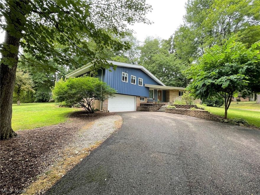 Beautiful split level on .57 acre corner lot. This home has 2,777 sf of living space. There are 3 bedrooms and 3 full bathrooms. Great room has a brick fireplace surrounded by built-in shelving. Lovely kitchen has center island, breakfast bar, eat in kitchen area and pantry. Kitchen appliances stay. Formal dining room with backyard access. Off the kitchen is a laundry room and an office area with access to the outside. Second floor updated bathroom has a granite counter and double vanity sinks. The spacious owner's bedroom has a dressing room, walk-in closet and updated owner's bathroom. The lower level family room has a brick fireplace with a grill area and access to the backyard patio. The backyard offers privacy and a great place to relax. Lots of basement storage space. Newer roof 2018 and updated electric. Exterior of home painted August 2021. Septic and well recently inspected and passed inspections.