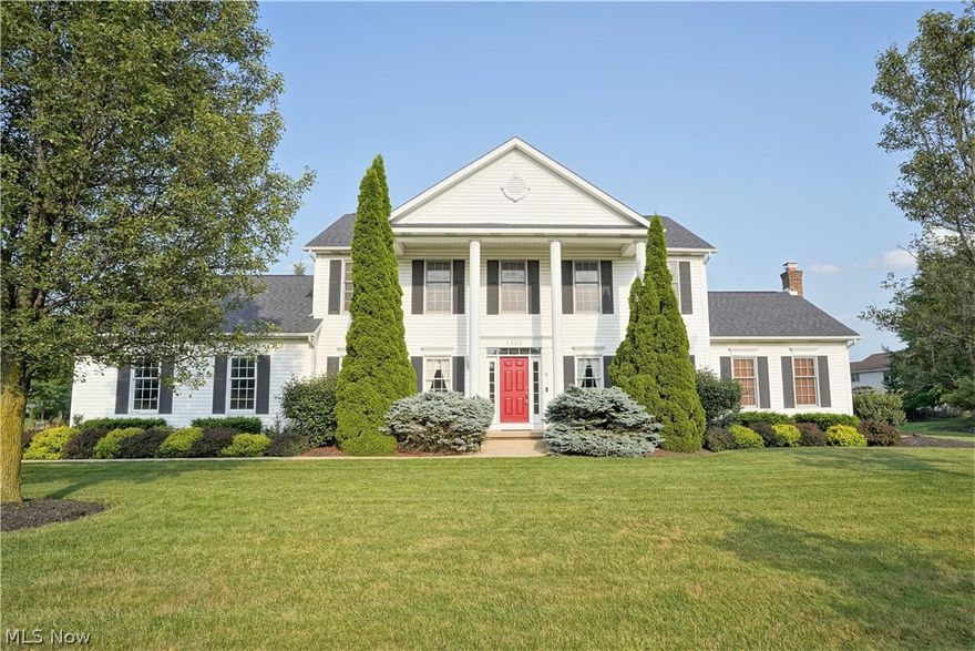 Gorgeous Georgian style colonial located in highly sought after Eastwicke Farms! Close to Metro Bike/Hike Trail, Silver Springs Park, Fox Den Golf Course and much more! Beautiful front porch graced with stately pillars highlights the front elevation of this home. Upon entering this home, you will see a pride of ownership the current owners have given to this home. Spacious foyer with ceramic flooring leads you to both the formal living room and dining room with hardwood flooring. Beautiful hardwood flooring. Straight to the rear of the home is the oversized kitchen with dinette area flanked with hardwood flooring. The bayed kitchen has granite countertops and tile backsplash. There is also a built-in desk. There are patio doors leading to the rear patio, great for relaxing outdoors. The vaulted family room boasts a floor to ceiling brick fireplace that is wood burning with a gas starter. For your convenience there is first floor laundry room.  The second floor is home to 4 bedrooms one