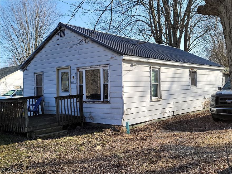 Investor Special! The work house been started and ready for you to finish! Would-be 2 bedroom, 1 bathroom Ranch with a 2 car detached garage. Some newer wiring has been added in. Newer Metal Roof on the house and the detached garage (under 3 years old). Kitchen Cabinets, doors and insulation are available at house for installation. Drainage system was placed in around foundation of home. Great potential for a flip or rental! Lakeview Schools.