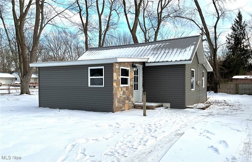 Tucked away on a nearly one-acre lot, this fully updated two-bedroom, one full-bath cottage style home offers the perfect balance of privacy and convenience. Located just minutes from Lake Erie, nearby parks, and everyday shopping, the home delivers a relaxed lifestyle with easy access to outdoor recreation and local amenities. The setting provides ample space for gardening, entertaining, or future expansion, while still feeling manageable and low maintenance.

Inside, this home has been thoughtfully renovated from top to bottom, blending modern finishes with classic charm. The updated kitchen and bath, refreshed flooring, and neutral décor create a clean, move-in-ready feel. Natural light fills the living spaces, and the efficient layout makes excellent use of every square foot. Whether you're looking for a full-time residence, a weekend retreat, or an investment opportunity, this property offers comfort, location, and land?an increasingly rare combination near the lake.