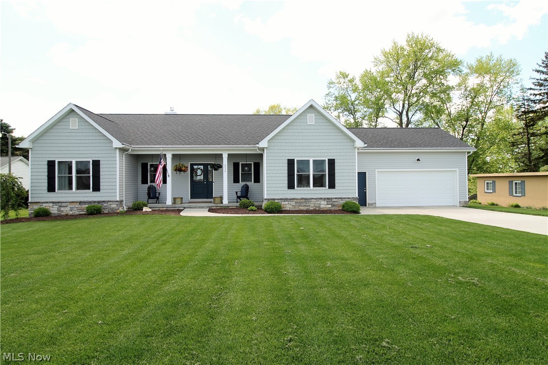WOW! Welcome to this stunning three possible four bedroom, three full bath ranch home built in 2017 with a front porch for sitting outside and relaxing. As you enter the front door there is a large open foyer to the great room with high ceilings and a stone gas fireplace with mantle and windows to let the natural light to shine through. Open dining room has slider door to the Timber Tech Deck (2020) to sit out and relax overlooking the fabulous large backyard. The large bright, gorgeous modern kitchen which is the heart of this beautiful home offers soft close cabinets, Quartz counters, stainless steel appliances, vent hood, built in microwave, pantry, and a large island offering more counterspace and a great spot to gather around while cooking that fabulous meal. Master suite offers a full bathroom with his and her sinks/cabinets, floor to ceiling tiled shower stall and large walk in closet. There are two more large bedrooms that share the full hall bathroom all on the opposite side o