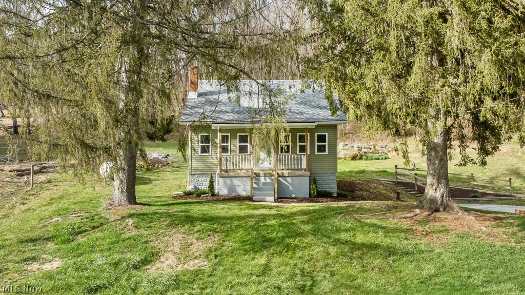 Move right into this country home just minutes from town and enjoy low maintenance living. Completely renovated, super cozy, the list of updates is impressive! On the interior, most of the home has been taken to the studs and new insulation, electrical, plumbing, drywall, flooring, fixtures and mouldings have been replaced. The kitchen features CUSTOM cabinets with soft close drawers and doors, tile, and new fixtures. Bathroom is a complete remodel. There is a main floor bedroom but another large bedroom/bonus room is finished with windows, closet, and carpeted upstairs. New flooring throughout. On the exterior, the windows, doors, roof, siding, porch, and C/A have been replaced. Property is eligible for USDA, no downpayment financing.
