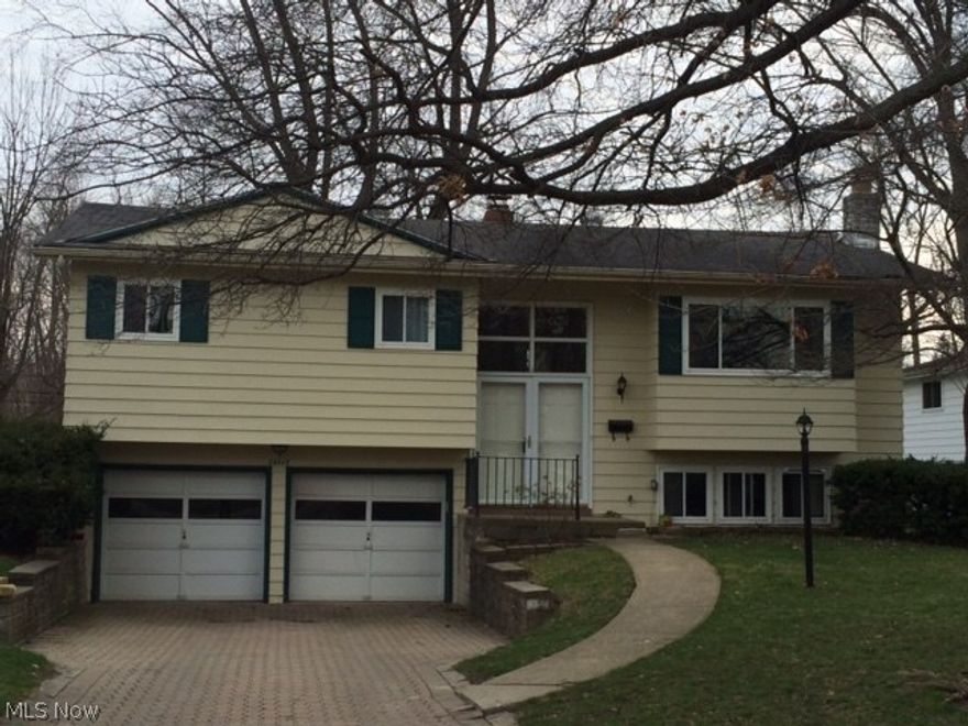 Welcome to Park Ridge. Attractive three bedroom home with many fabulous features! Walk up and drive in on the only paver driveway in the area! Two car garage. Gleaming wood floors through out the main floor, Very spacious Living room and dining room. Newer kitchen appliances included! Energy efficient exterior doors and windows, whole house attic fan, home has extra insulation in attic and garage ceiling.  Newer central air unit.  Energy efficient newer patio door leads to a two story Solarium! Fabulous lower level family room with gas fireplace! Newer flooring throughout lower level Two full baths! Spacious yard with newer shed and a seven person Hot Tub on decorative paver patio included! Good attic storage . Low optional HOA fee no restrictions.  Homes backs up to Spruce Elementary School which has play grounds and baseball field!