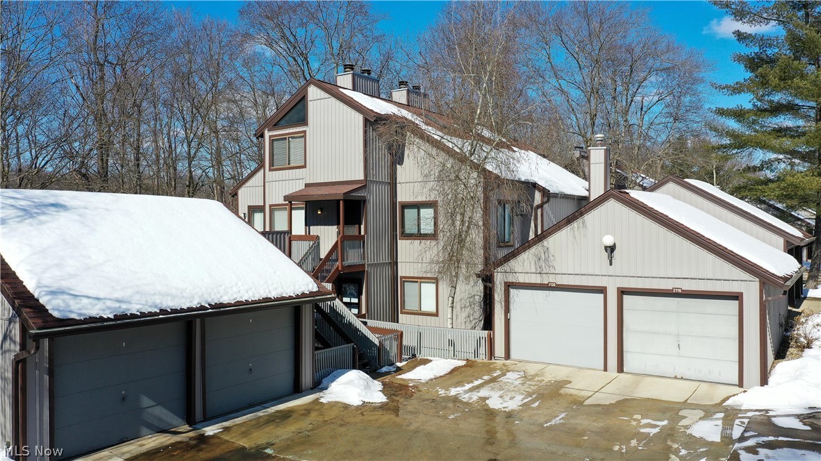 2021 Pinebrook Trail Cuyahoga Falls OH 44223 is stunning! Beautiful updated condo has 2 large bedrooms & 2 full bathrooms in the highly desired condominium Pine Mill complex surrounded by valley views of Northhampton area in the Woodridge School District. This condo has everything from plenty of storage, large rooms & gorgeous views to your own 1 car garage w/ new door. Main level consists of the professionally designed kitchen which has plenty of gorgeous cabinetry, granite countertops w/ lots of flow, stainless steel appliances, wonderful lighting & floating shelving to round out the area with the Breakfast Bar as well as open concept dining area surrounded by natural light. The Great Room has the most wonderful views of the woods surrounded by windows & sliding doors... absolutely magnificent, calming & nature, nature, nature. Ambiance of the fireplace wall & the open stairs with huge loft bedroom suite overlooking the Great Room w/ even more views! The main floor bedroom is large enough as it's own suite w/ multiple closets, hall full bath w/ shower, hall laundry (full size laundry) & LVT flooring in the main area. Upper floor huge master suite has vaulted ceilings, fully remodeled beautiful bathroom w/ 2 sinks, granite, plenty of light, huge walk in closet & enormous bonus storage room!! Deck for outdoor living & animal watching! Includes inground swimming pool, lots of hiking, biking, parks, close proximity to the Market District area w/ plenty of eateries & shopping!