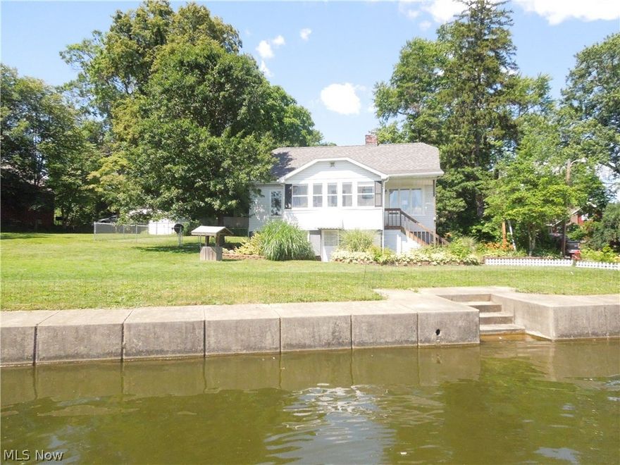 Welcome to 870 Sail Drive. This cute bungalow has been recently updated and move in ready. Located on a dead end street in portage lakes North Reservoir. This home is situated on a private lot that has no immediate neighbors beside you. You have a large lot at .399 acres along with 148 Linear feet of water front to enjoy. The lot is larger than normally what you find. The yard has a nice sized portion fenced in for the family pet. The move in condition, Walk out basement, first floor Master Bedroom, oversized water front are just a few of the appealing points that make this such a nice home. Easy to dock your boat, put out chairs to enjoy the view, plenty of space for fishing. Do not miss this opportunity to enjoy a lake front home with this much yard and frontage. Call for your private showing today. Americas Preferred Home Warranty included with an accepted offer too!