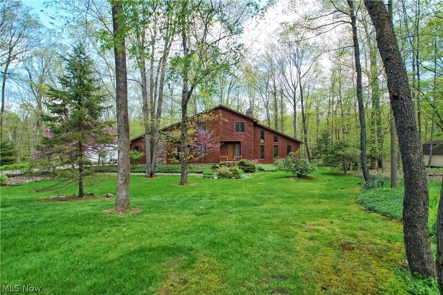 Absolutely breathtaking property located in Bainbridge Twp. Imagine sitting on your screened in porch with your morning coffee, overlooking a completely private wooded ravine backing to nearly 50 acres of serenity. This could be your every morning in this 2600+SF, 4 bedroom, 3.5 bath open floor-plan home. First floor features an open kitchen, dining room, and great room with vaulted ceilings plus skylights. Also located on the first floor is an option of a 1st floor master bedroom/in-law suite with full bath! 2nd floor features a master bedroom complete with master bath and walk in closet, 2 generously sized bedrooms that share a bath and a library loft with built in bookcases. HUGE basement that can easily be finished to allow for plenty of extra rec room space. This home is truly unique and private. Take a second to sit out on the back porch and enjoy nature: you will never want to leave.