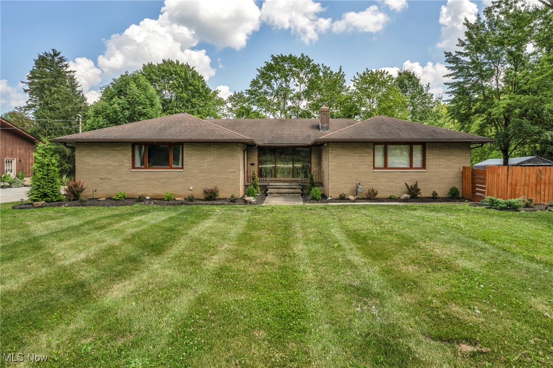 Welcome to this beautifully updated 5-bedroom,5.5 bath all-brick ranch,offering the perfect blend of modern upgrades and country living on 8.85 acres!As you arrive,you’re greeted by outstanding curb appeal with professional landscaping,a new front door,and a wrap-around deck overlooking your private retreat.Inside,you’ll find new LVP flooring,fresh trim,and new interior doors throughout.The spacious eat-in kitchen features beautiful cabinetry,island seating,appliances,and plenty of storage.The formal dining room flows into the living room with its stunning new stone fireplace and wood-burning insert!First three bedrooms are on the main leves,with the owner’s suite offering a full bath,two large closets,and a ceiling fan,plus a hallway bath for the remaining rooms.The fully finished walkout basement has been completely transformed with new electrical,panel and subpanel,insulated walls and floors,and a full bar.This lower level offers a huge rec/party room,two bedrooms each with their own full bath that’s completely remodeled,and one of the bedrooms has a walk in closet.There is also an additional 2 half baths in the basement—perfect for entertaining,multi-generational living,or guest space.Outside is where this property truly shines!The house also has a built in vacuum system,The detached 6-car garage has been newly sided(Aug 2025)with new gutters,newer doors,gas heat,a wood-burning stove,and a pool table that conveys.This can be a perfect man cave!The 60×40 barn also features new siding(Aug 2025),new doors,and updated drainage,making it ideal for,storage or workshop use.Enjoy your own garden,fruit
trees(grapes,apples,peaches,plums,blueberries).A security camera system conveys!in 2022 the house was connected to public sewer.There is also a lightning rod,and a backup generator!Just minutes from the Metroparks,schools, highways and nearly 9 acres of land. Plus zoning that allows up to 7 horses.Schedule your private tour today!