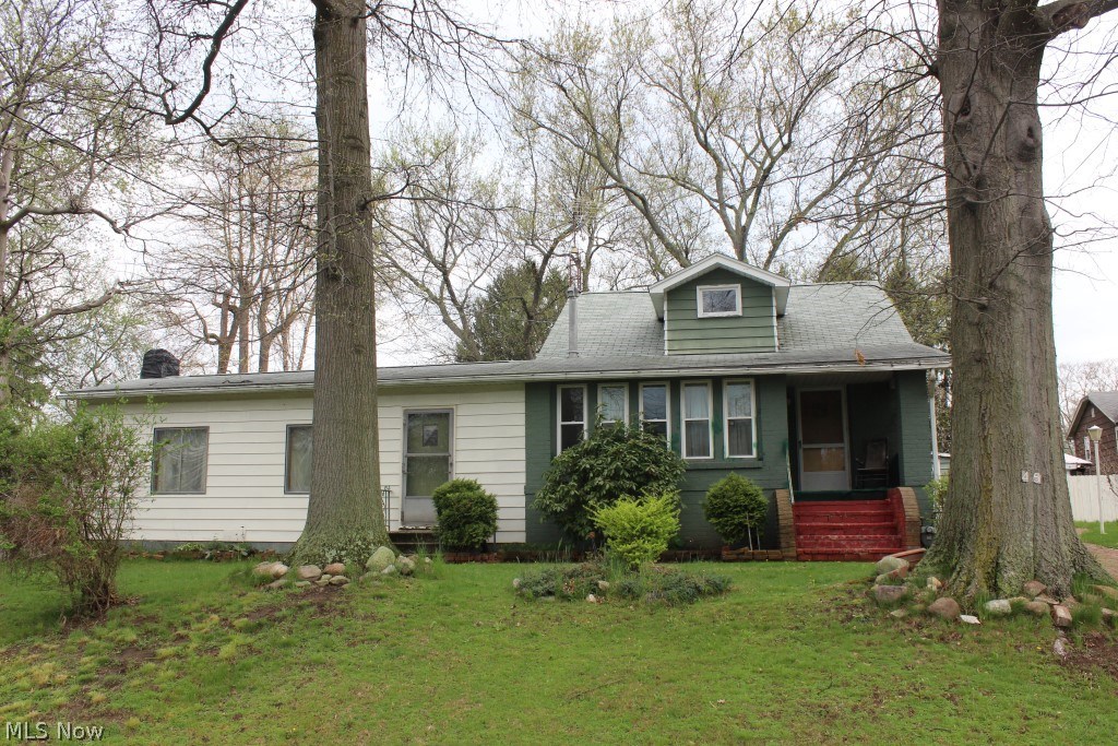 Spacious 3 bedroom/1 bath Cape with 1544SF on 120x100 lot conveniently located close to Portage lakes & expressway* Huge great room with wood burning fireplace & access doors to front & back yard* 4 season sun room/living room* Dining room off of kitchen* 2 first floor bedrooms (one with access to enclosed patio)* 1st floor bath* 2nd floor bedroom with mega storage* 3x16 enclosed patio with oversized built in barbecue* Full unfinished basement* 2 car detached garage* Fenced in back yard* Sewer/well* Shingles approx. 15 yrs.* Furnace 1/29/18* Electrical service box, 2018* Hot water heater approx. 3 years* Replacement windows* Appliances include refrigerator, range, washer & dryer* Excellent value!