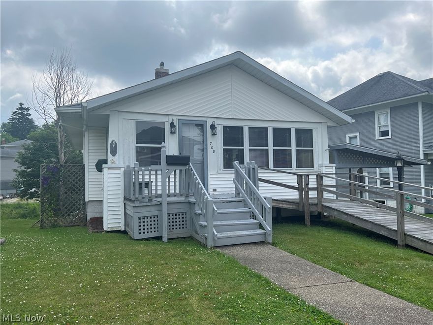 Classic charmer with the bones to back your vision! This lovely bungalow is on the north side of town close to the hospital and park with  lots of updates including a new roof, gutters, & leaf guard on the home, carport and shed in 2018. The home has double hung storm windows & new gas hot water tank in 2021. The basement has a gas stove in the basement as well as all hookups for laundry and bath. The home also has a natural gas hook-up on the back deck for your gas grill. Under the berber carpet in the living room and dining room is the original hard wood flooring. Home also has a wheelchair ramp access leading to the front door. This well-maintained, sturdy house is ready for fresh life and to become your new home!