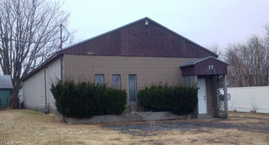 Solid building (2100 sq.ft.) with overhead door, restrooms, and small office. Also available for lease at $950/month plus utilities.