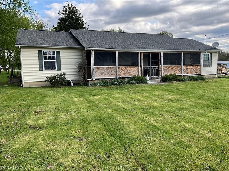 Nicely maintained 1700 sq ft manufactured home that has been converted to real estate. Nice, spacious living room with large primary bedroom w/bath, large kitchen & formal dining room. Nice 33'x6' screened in front porch, storage shed, roof updated in 2016, carport & concrete crawl space. Home is on a double lot (92'x 157').