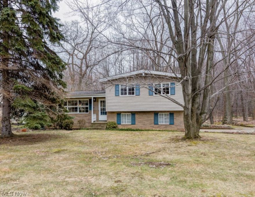 Welcome Home! This private wooded lot with small stream set the scene for this beautifully maintained one owner family home. Three spacious bedrooms with all wood floors, updated bath, updated kitchen, dining room to deck overlooking beautiful property. Exposed beam on main level adds special character to this lovely home. Separate family room and living room lend to easy living. Partial basement for laundry, storage and utilities. This home is a must see. Move in and start making memories!