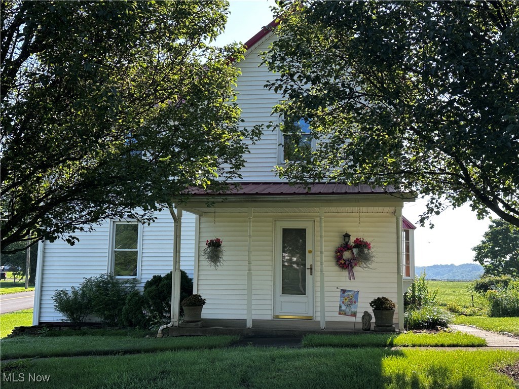 Take a look at this beautiful well well-maintained 2-story conventional home on a double corner lot. This home features several areas for enjoying the outdoors and entertaining. The house has a large backyard with a nice patio that offers an exterior entrance to the basement. Step into the back door into a sun room nice to sit and enjoy looking outside all 4 seasons. The home has a large eat-in kitchen including appliances, living room with a covered porch front door entrance, followed by a secondary flex space that would make a nice office. Another room was used as the 4th bedroom, and an updated full bath with step-in tub. Off the kitchen is a stack washer and dryer that stay with the home for added convenience on the main floor. Upstairs,s you will find 3 bedrooms with closets for plenty of storage. The basement has additional washer /dryer hookups, and lots of storage shelving along with walkout steps to the back patio. There is an oversized 2 car garage on the second lot with a gravel floor. This lot features a concrete patio with beautiful landscaping throughout both lots with this property. Lots of updates over the last 14 years including a new roof, Central AC unit, windows and siding. Sump pump in basement. There is a cistern hookup if you are wanting rainwater for gardens. This property is conveniently located close to amenities. This is an AS IS property.