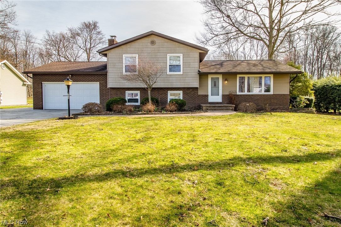 Don't miss your opportunity to see this home! This spacious, updated split-level has been meticulously maintained and is perfect for family and entertaining. with three bedrooms and two bathrooms. The formal living room is open to the dining area and kitchen that showcases modern appliances and cabinets. The sliding glass doors lead to a sunroom and large backyard. The family room level includes a fireplace, laundry room, and full bath. The basement area offers room for storage, an office, or work room. The sizeable, landscaped backyard has a garden and a storage shed in the back. The home was painted throughout in 2024 along with the 2nd floor flooring. 1 year home warranty provided by sellers from American Preferred home warranty!