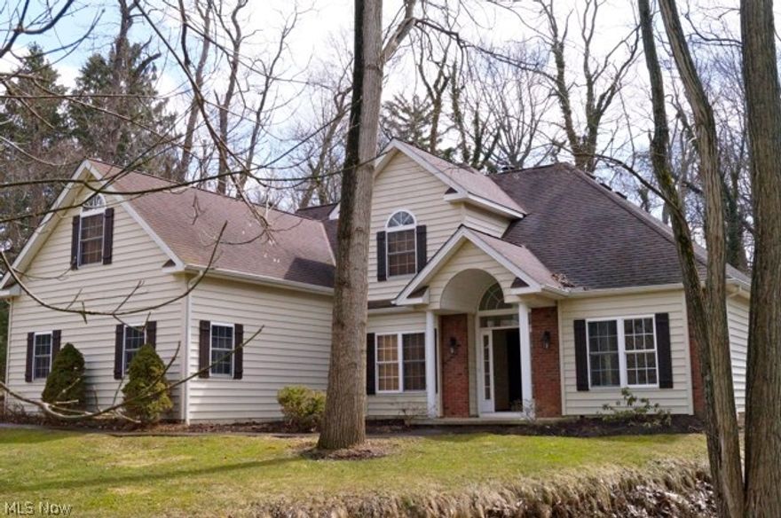 Welcome to the most unique setting in Olmsted Falls! This wooded paradise sits on a gorgeous 2.24 acre lot with a winding creek! Move right into this completely updated impeccable home. Expansive kitchen offers granite counter tops, tile back splash and all stainless steel appliances! Eat-in area offers a beautiful dual sided fireplace and slider leading to out door patio. Enjoy the private patio and all that nature has to offer. Kitchen flows to formal dining room with amazing hardwood flooring and architectural ceiling. Grand two story living room offers a stone fireplace opening to eat in kitchen. Mater suite offers it's own fireplace and attached glamor bath with double bowl sinks. On the second level you will find three enormous bedrooms, one of which could be a second master suite. Lastly, this pristine property offers a large 3 1/2 car garage. A truly unique must see to appreciate!