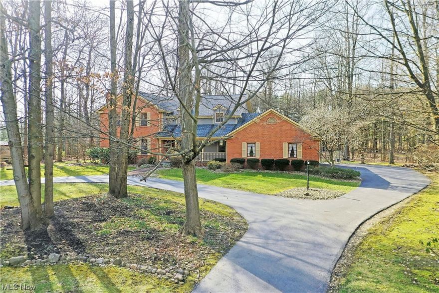 You won't find this much square footage + storage space anywhere else in Canfield!  Conveniently located 5 minutes from Ohio turnpike and route 11 for easy commute to work, shopping, Pittsburgh and more. Some of what's new since 2020: New furnace, heat pump and a/c compressor, hot water heater (one hot water heater is for the second floor and the other is for the first floor), new Gordon Brothers reverse osmosis water filtration system, new GE Cafe double convection range, new whisper Whirlpool stainless steel interior dishwasher, custom granite counters in kitchen and powder room. Primary bath renovated clear to the studs by Duncan Kitchen & Bath (heated floor, soaking tub, spectacular shower, double vanity, bidet and more). New Whirlpool high-capacity washer and dryer.  Painted throughout. New sustainable bamboo flooring in dining, hall and office.  New luxury vinyl flooring in the basement.  New Kitchler lighting fixtures throughout, Guardian alarm system and surveillance cameras.  New fence in portion of the back yard--note that the property line extends into the woods.  Previous MLS shows:  new Roof and siding 2017.  An abundance of storage awaits you in this quality, timeless home.  

Custom designed and built with quality workmanship.  Three floors of finished living space!  Staircase located between the formal dining room and living room w/ FP plus office/guest room. Casual dining space divides the custom kitchen and the family room which leads to sunroom.  Polished stone countertops, newer appliances, custom cherry cabinets and hand-blown German glass front provide the perfect kitchen.  First floor laundry hides away near a half bath and garage. On the second floor, oversized primary suite wows with pass-through closet space to bonus storage + a huge walk-in closet + one-of-a-kind bath.  An additional full bath joins the remaining bedrooms. Finished basement has a full bar, wine cellar, telephone booth, rec and gym space and tons of storage.