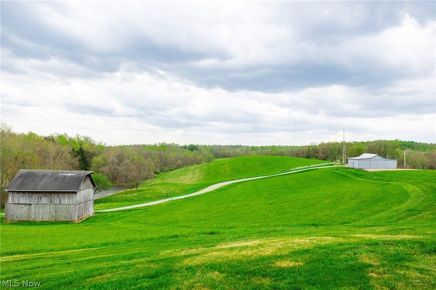 Onsite auction Thursday, May 28th at 6:00 PM. A well-rounded tract featuring 329’ of road frontage, a mix of open and wooded ground, along with rolling hills that transition into steeper terrain. Improvements include a 36’ x 24’ barn and a 40’ x 40’ pole building, making it well-suited for equipment storage, livestock, or hobby farming. A stocked pond adds both function and scenic appeal to this parcel.